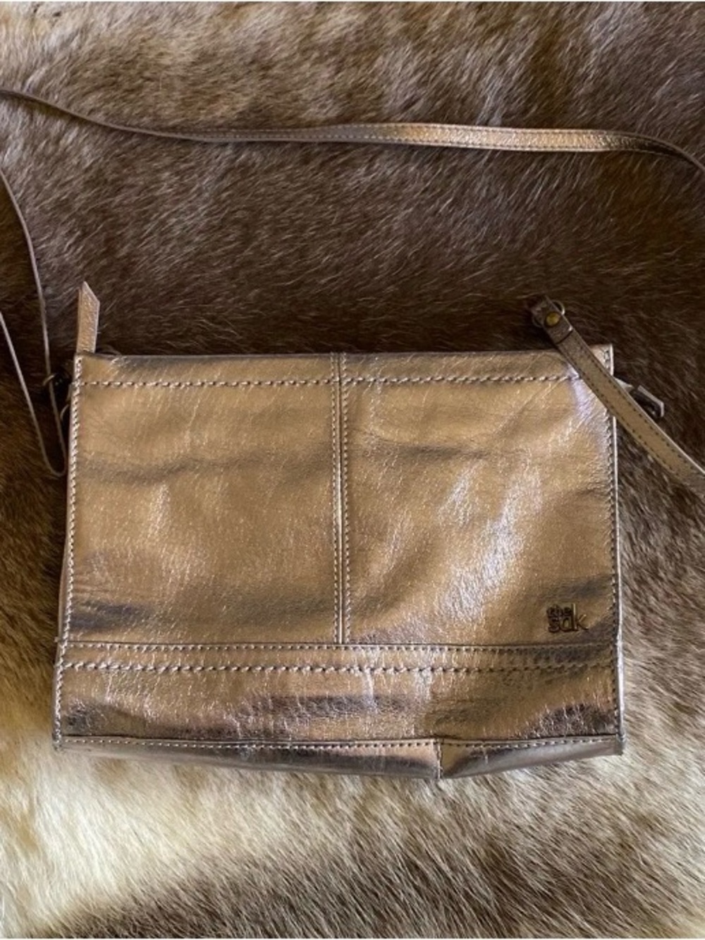 The Sak Metallic Bronze Crossbody with Colorful Lined Interior